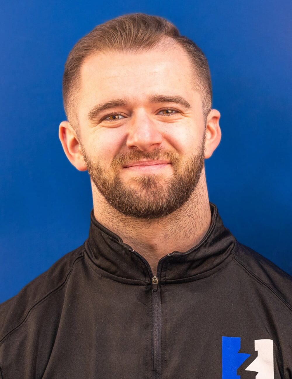 Eric Rhodes headshot — Director of Performance and Co-Owner of HammerZone Performance