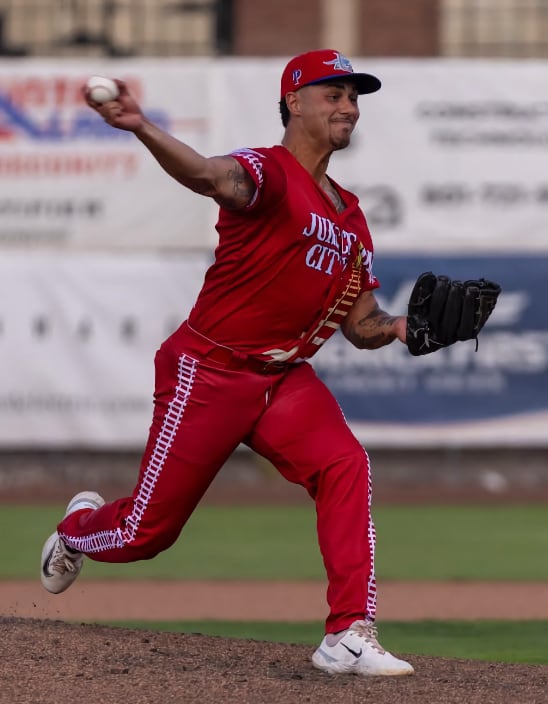 Rafi Vazquez pitching in a college baseball uniform — HammerZone Sports baseball instructor