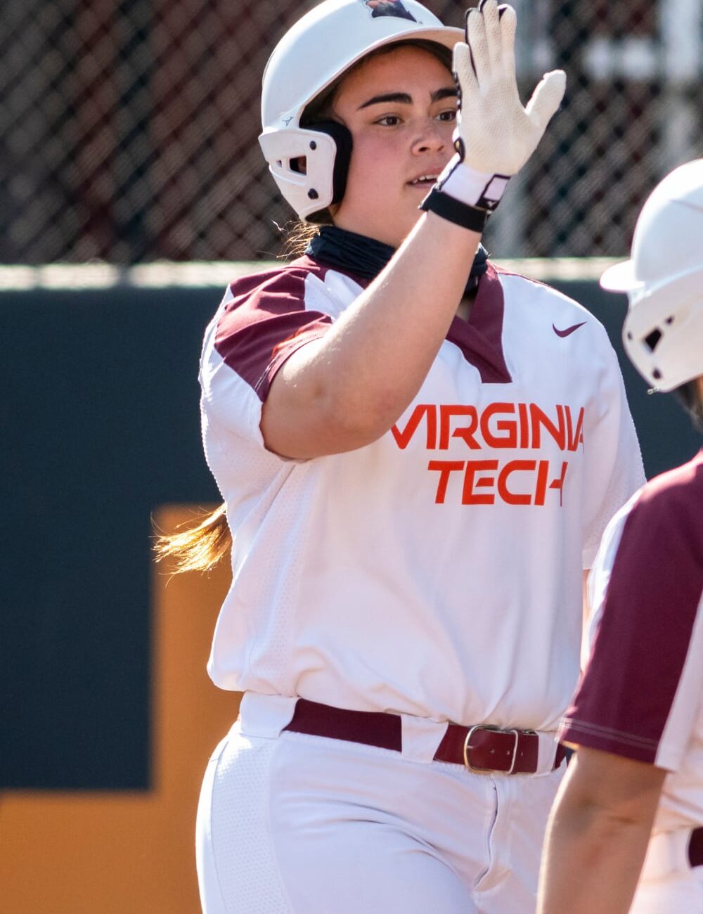 Grace Chavez batting in her Virginia Tech softball uniform — HammerZone Softball instructor