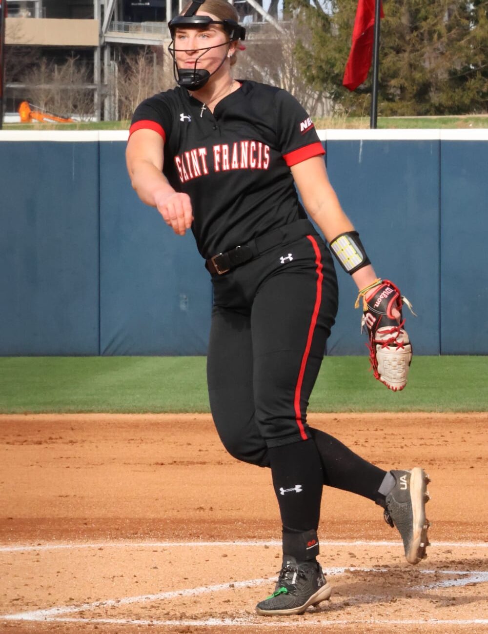 Maddy Bates pitching for her college softball team — HammerZone Softball instructor
